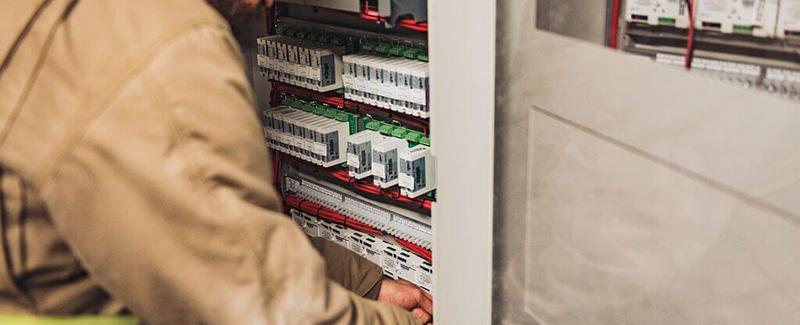 man working on security panel